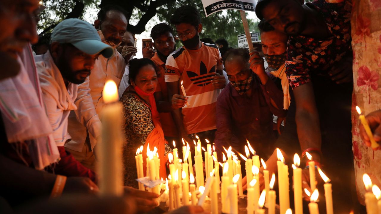 People attend a candlelight vigil to protest against the alleged rape and murder of a 9-year-old girl in New Delhi, India, August 8, 2021.
