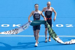 Snyder and his guide Greg Billington compete in the men's triathlon category PTVI during the Tokyo 2020 Paralympics at the Odaiba Marine Park. 