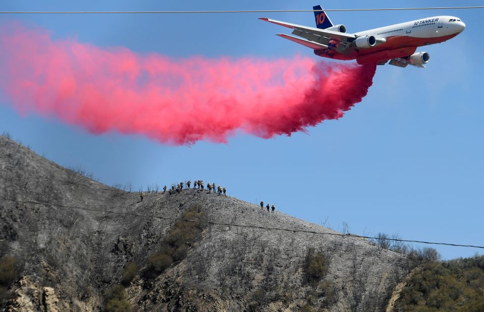 A tanker makes a fire-retardant drop near Lytle Creek, California, on August 26 as efforts continued to stop the South Fire.