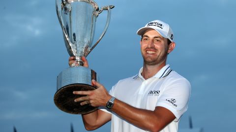 Patrick Cantlay celebrates with the trophy after winning the BMW Championship.