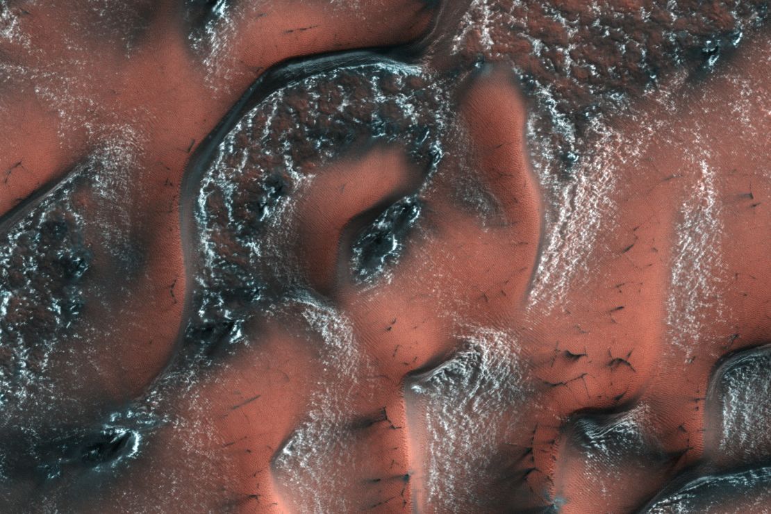 This image taken by the Mars Reconnaissance Orbiter shows a dusting of snow on the dunes of Mars' Northern hemisphere in 2017.