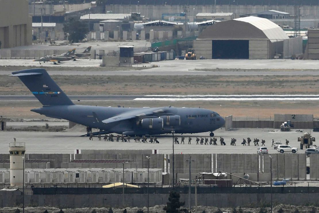 US soldiers board an US Air Force aircraft at the airport in Kabul on August 30, 2021.  