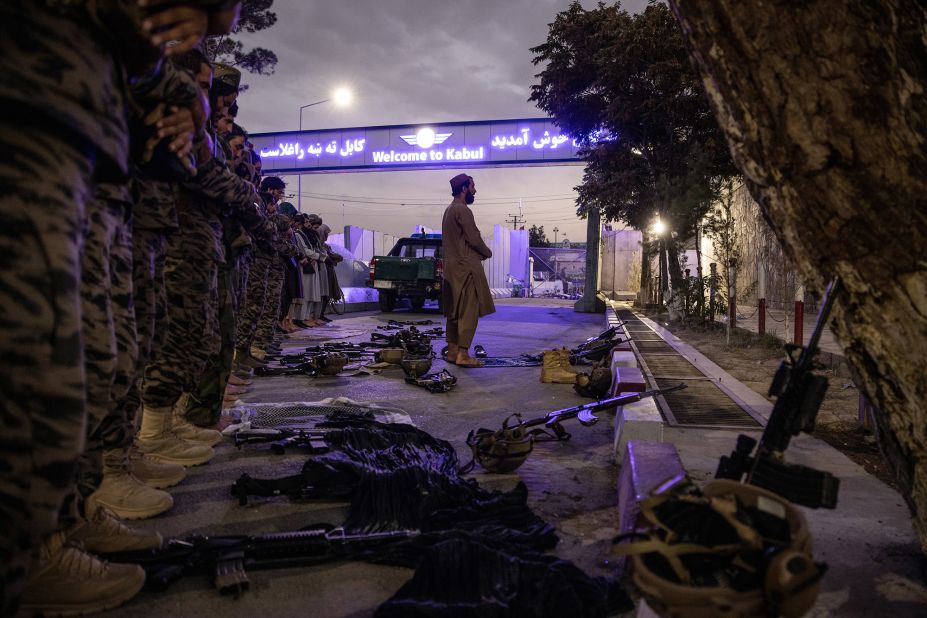 Members of the Badri 313 Battalion, a group of Taliban special forces fighters tasked with securing the area surrounding the Kabul airport, perform evening prayers on August 28.