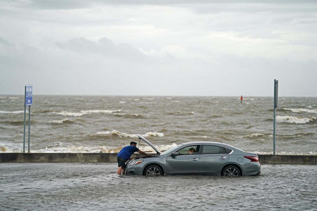 A stranded motorist on Beach Boulevard in Biloxi, Mississippi, on Monday.