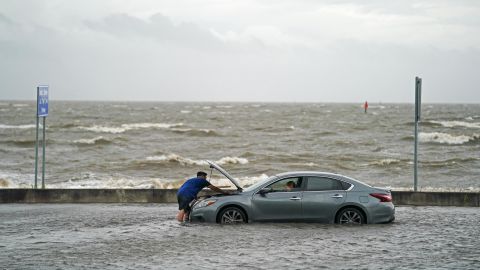 A stranded motorist on Beach Boulevard in Biloxi, Mississippi, on Monday.