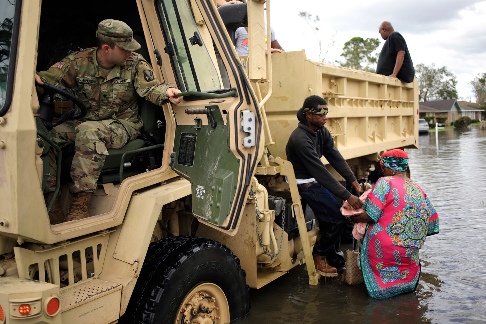 Residents are rescued from floodwaters in LaPlace on August 30.