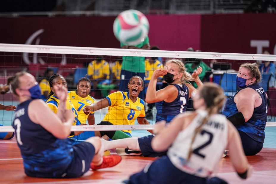 Rwanda's Carine Kwizera, center, reacts after spiking a ball during a sitting volleyball match against the United States on August 28.