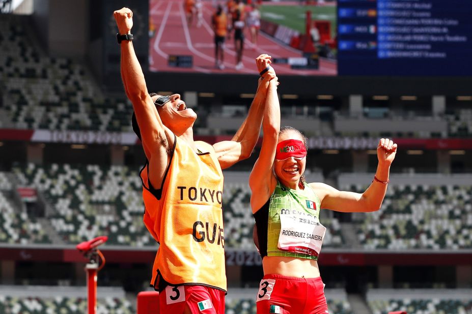 Mexico's Mónica Olivia Rodriguez and her guide, Kevin Teodoro Aguilar Perez, react after she won gold in a 1,500-meter race on August 30.