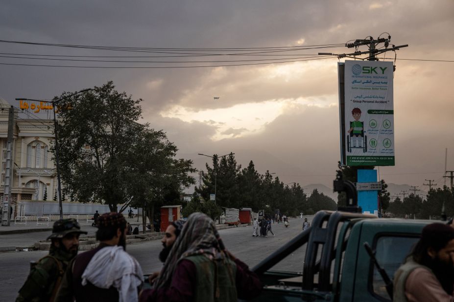 A C-17 military transport plane is a dot in the sky as it leaves Kabul on August 30.