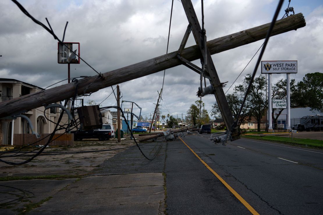 A downed utility pole blocks part of a roadway in Houma, Louisiana, on August 30  after Hurricane Ida swept through the region.