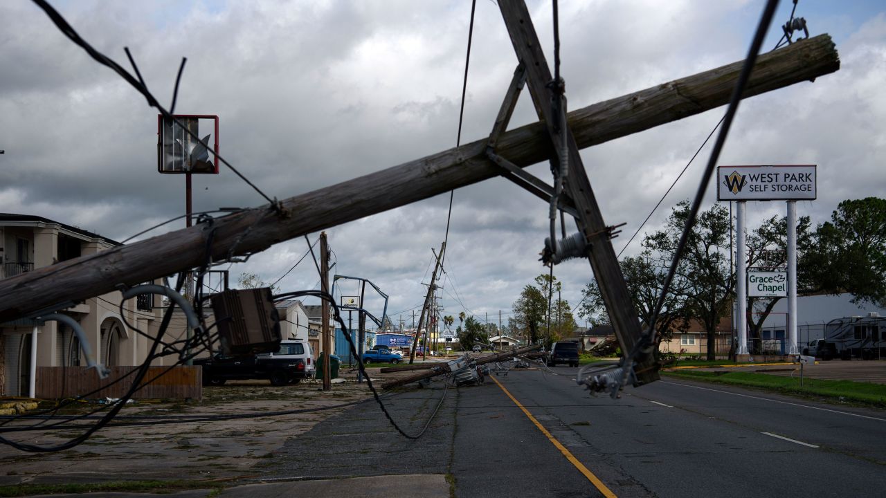 A downed utility pole blocks part of a roadway in Houma, Louisiana, on August 30 after Hurricane Ida swept through the region.