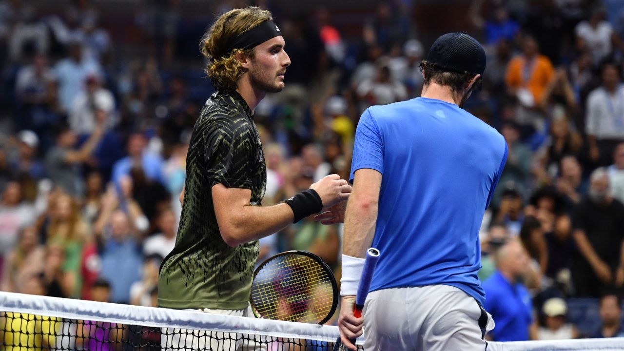TOPSHOT - Greece's Stefanos Tsitsipas (L) shakes hands with Britain's Andy Murray after winning their 2021 US Open Tennis tournament men's singles first round match at the USTA Billie Jean King National Tennis Center in New York, on August 30, 2021. (Photo by Angela Weiss / AFP) (Photo by Angela Weiss/AFP via Getty Images)