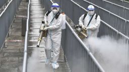 ZHANGJIAJIE, CHINA - AUGUST 26: Workers wearing personal protective equipment (PPE) spray disinfectant at Tianmen Mountain Scenic Area in an attempt to halt the spread of the Covid-19 coronavirus on August 26, 2021 in Zhangjiajie, Hunan Province of China. (Photo by Shao Ying/VCG via Getty Images)