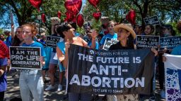 Protesters stand near the gate of the Texas state capitol at a protest outside the Texas state capitol on May 29, 2021 in Austin, Texas. Thousands of protesters came out in response to a new bill outlawing abortions after a fetal heartbeat is detected signed on Wednesday by Texas Governor Greg Abbot. 