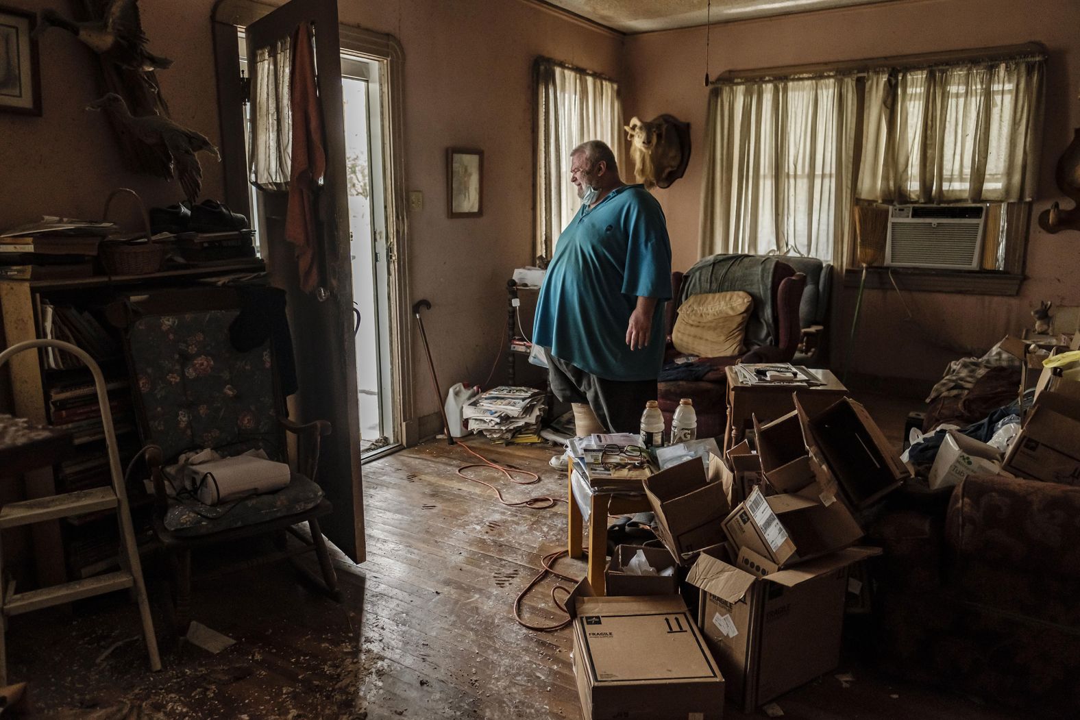 Michael Wilson stands in the doorway of his flood-damaged home in Norco, Louisiana, on August 30.