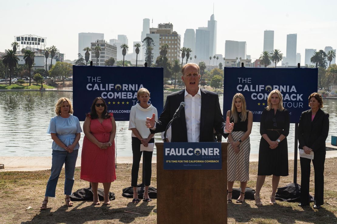 California gubernatorial candidate and former San Diego mayor Kevin Faulconer, center, speaks to the media at a campaign stop to promote his "women's empowerment plan" at MacArthur Park in Los Angeles Monday, Aug. 30, 2021. 