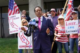 In this July 14, 2021, file photo, radio talk show host Larry Elder speaks to supporters during a campaign stop in Norwalk, California. 