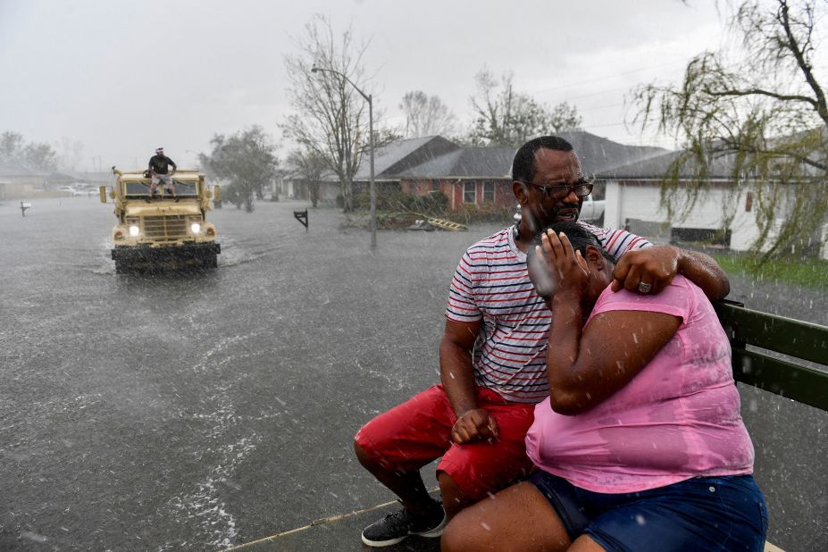 A rain shower soaks evacuees in LaPlace, Louisiana, on August 30.