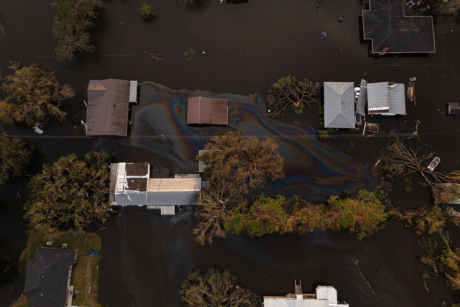 An oil slick is seen on top of floodwaters in Kraemer, Louisiana, on August 30.