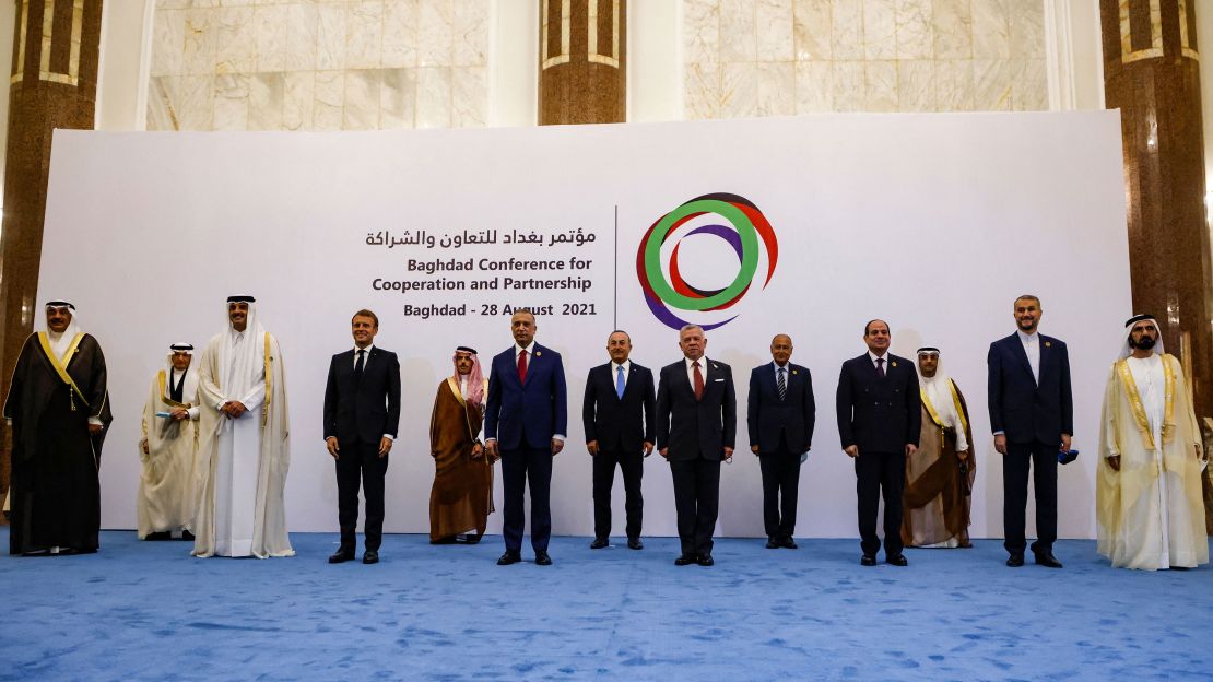 Breaching diplomatic protocol, the Iranian top diplomat stood in a row with country leaders during a group photo. His assigned placement was next to the Saudi top diplomat, alongside other foreign ministers. 