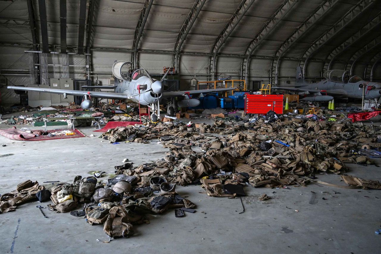 Afghan Air Force attack aircraft are pictured amid armored vests inside a hangar at the Kabul airport on August 31. Pentagon Press Secretary John Kirby said the US military had made "unusable all the gear that is at the airport -- all the aircraft, all the ground vehicles."
