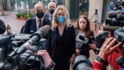 Elizabeth Holmes, the founder and former CEO of blood testing and life sciences company Theranos, arrives for the first day of jury selection in her fraud trial, outside Federal Court in San Jose, California on August 31, 2021. 