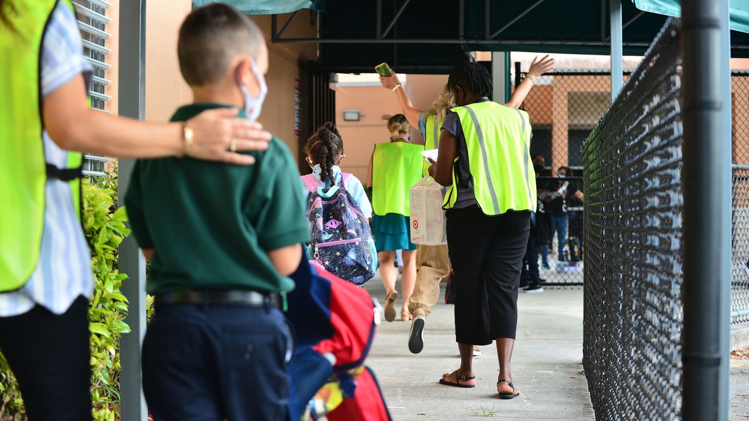 Faculty and students on the first day of class at Pembroke Pines Charter Elementary in Broward County, Florida.