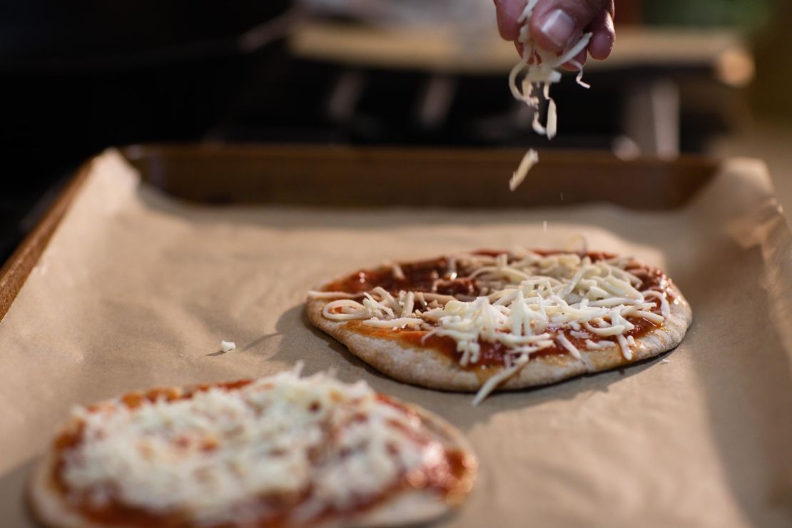 Sprinkling the mozzarella is also a good task to engage kids in the kitchen.