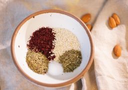 (Clockwise from bottom left) Za'atar blends thyme, sumac, sesame seeds and oregano with salt. 