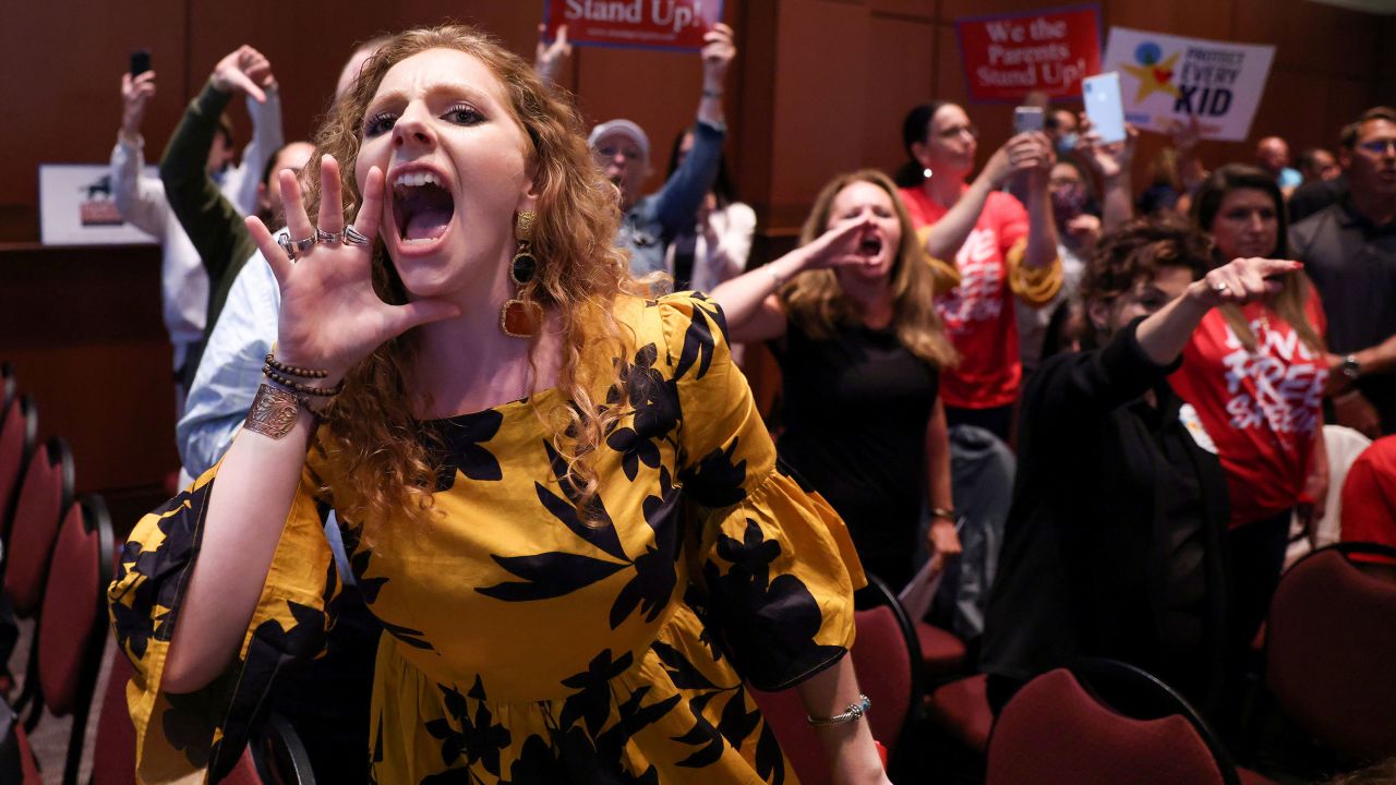 Angry parents and community members protest after a Loudoun County School Board meeting was halted by the school board because the crowd refused to quiet down, Ashburn, Virginia, June 22, 2021.