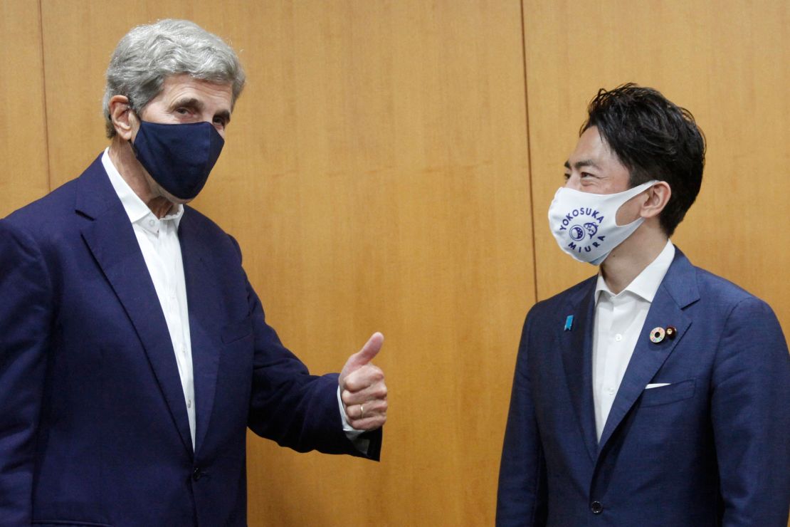 US climate envoy John Kerry (L) meets with Japan's Minister of the Environment Shinjiro Koizumi (R) at the offices of the Ministry of the Environment in Tokyo on August 31, 2021. 