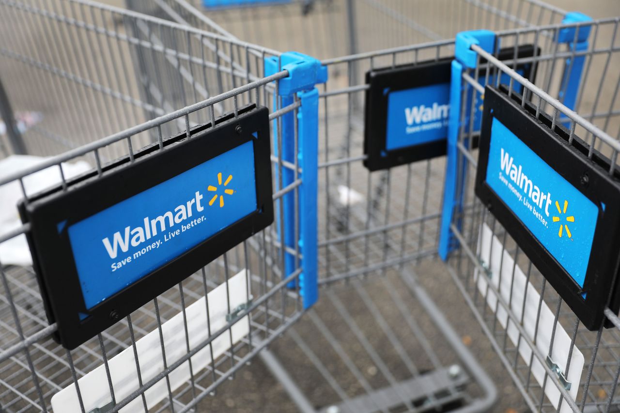 Shopping carts are seen outside of a Walmart store in Miami, Florida on February 18.