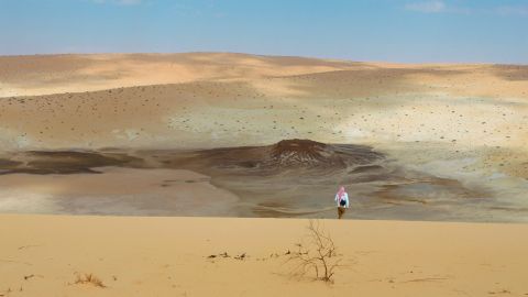 Archaeologists survey the Nefud Desert in northern Saudi Arabia. Ancient lakes formed in the hollows between dunes thousands of years ago during periods of increased rainfall.