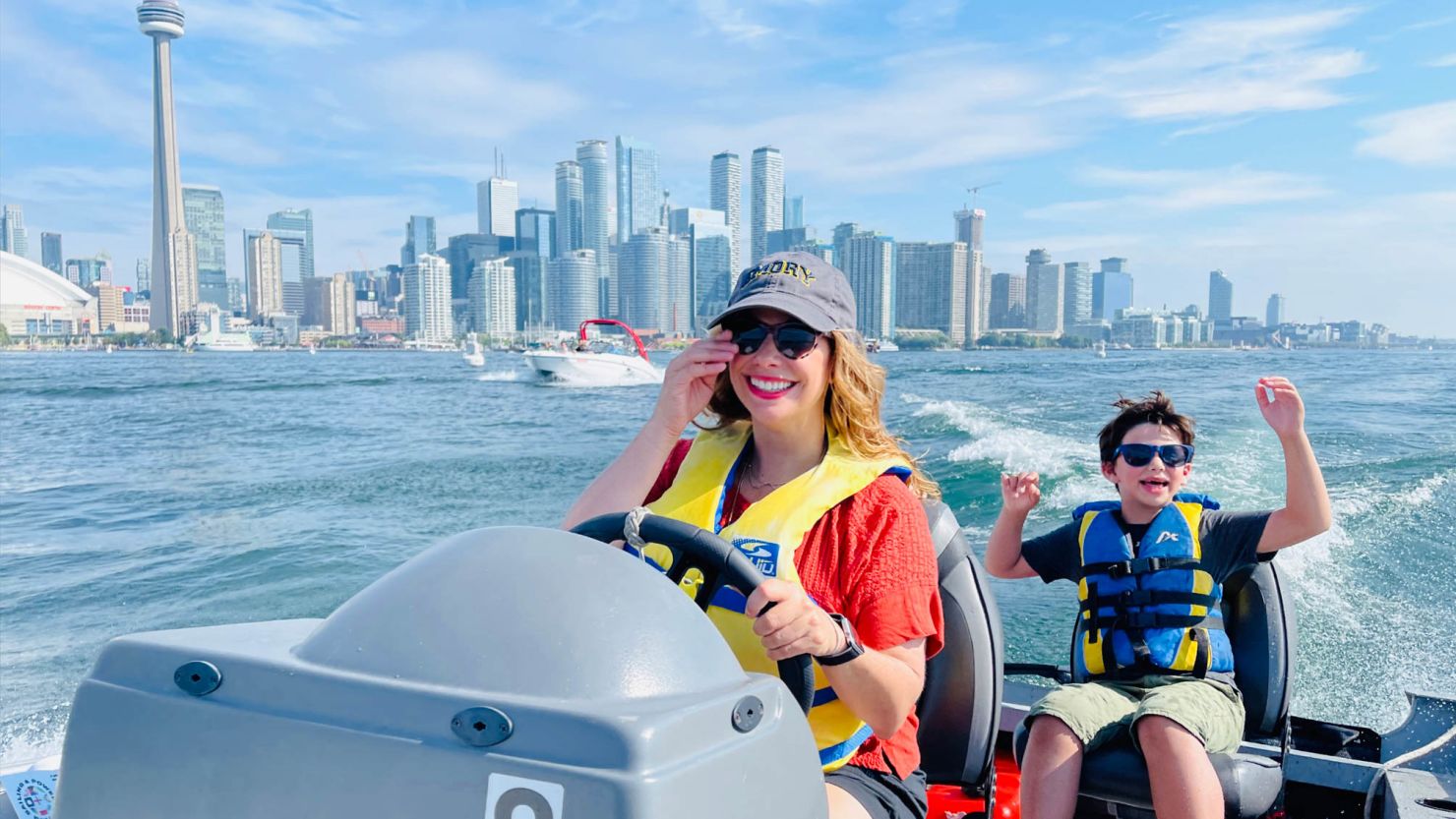 Rebecca Soffer and her son, Noah, navigating through the Toronto Harbour.