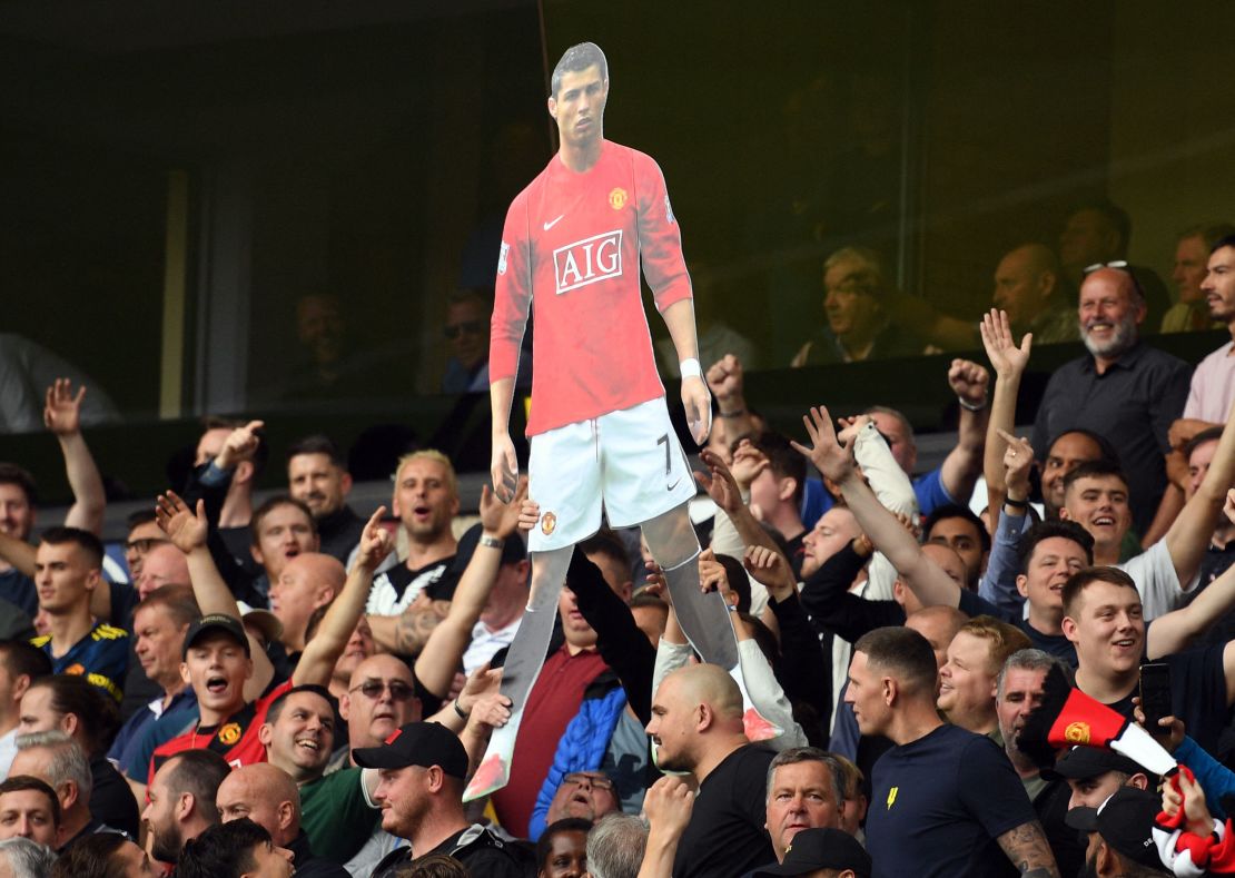 Manchester United fans hold up a cardboard cut out of Cristiano Ronaldo during their Premier League match at Wolves.