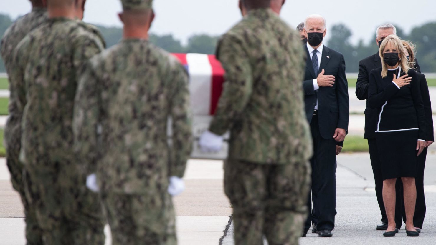 US President Joe Biden, US First Lady Jill Biden, and other officials, attends the dignified transfer of the remains of fallen service members at Dover Air Force Base in Dover, Delaware on August 29, 2021.
