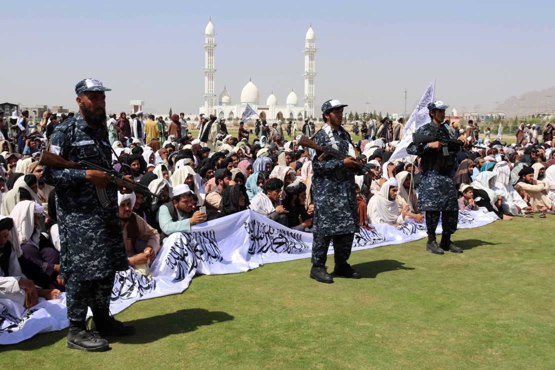 Taliban supporters gather to listen to the Taliban's governor for Kandahar province.