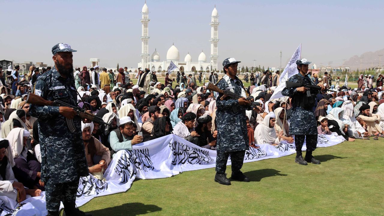 Taliban supporters gather to listen to the Taliban's governor for Kandahar province.