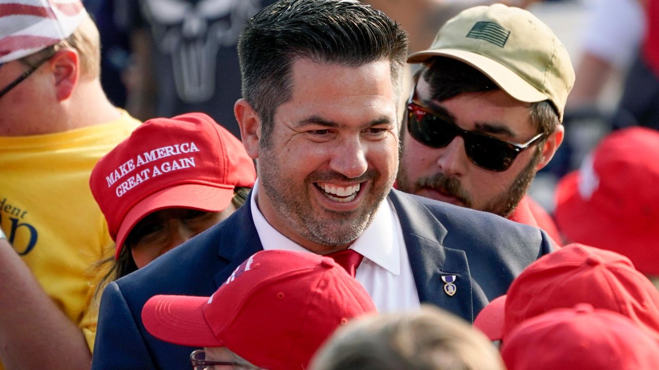In this September 2020 file photo, Sean Parnell walks through people gathered at a campaign rally for President Donald Trump at the Pittsburgh International Airport in Moon Township, Pennsylvania.