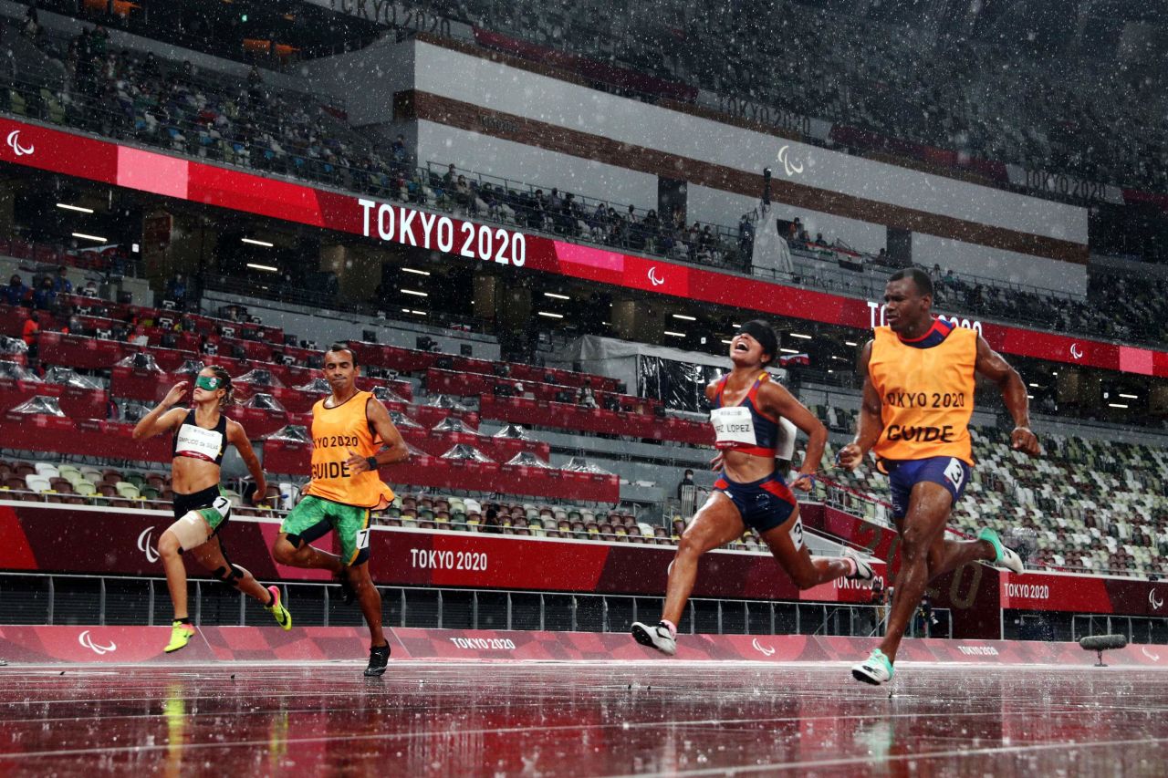 Brazil's Thalita Simplício, left, and Venezuela's Alejandra Paola Pérez López compete alongside their guides during a 100-meter race on Tuesday, August 31.