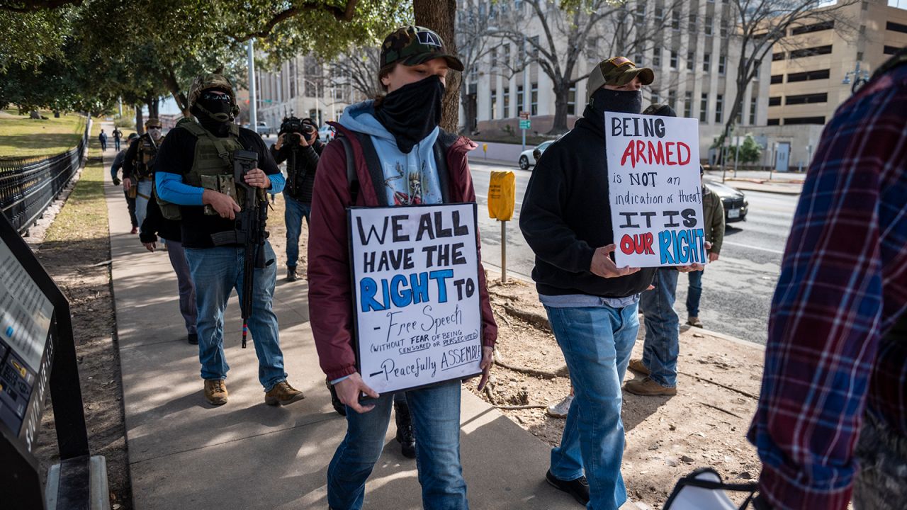 Protesters walk toward the Texas State Capitol on January 17, 2021, in Austin.