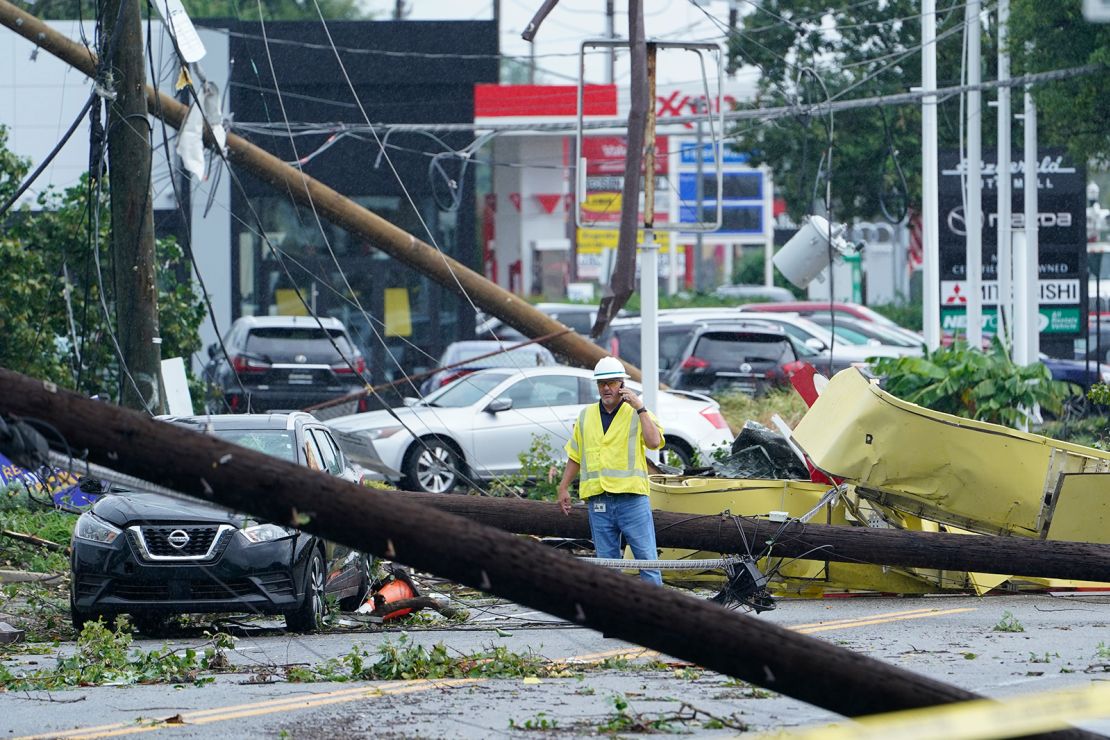 A man surveys the debris strewn along a street in Annapolis, Maryland.