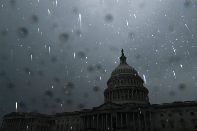 Raindrops are illuminated by a camera flash near the US Capitol as Ida's remnants pass over Washington, DC, on September 1.