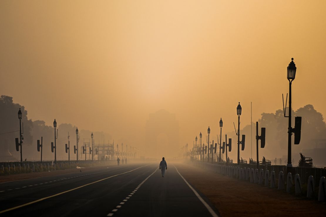 A man walks amid smoggy conditions in New Delhi on January 28, 2021. 