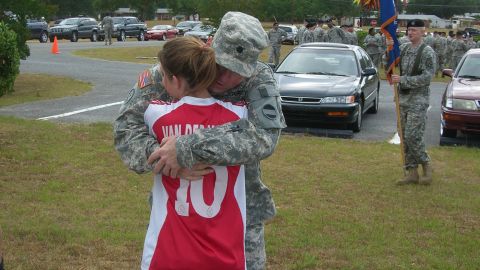 Kelly McHugh embraces her father John McHugh on Fort Rucker, Alabama, before his year-long deployment to Kuwait in June 2007.