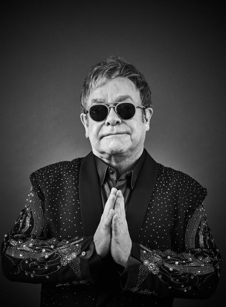 Sir Elton John pictured wearing his quintessential sunglasses. 