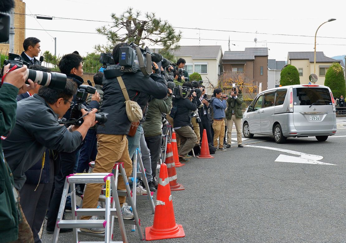 A car carrying Chisako Kakehi leaves the police station on November 20, 2014, in Muko, Japan.