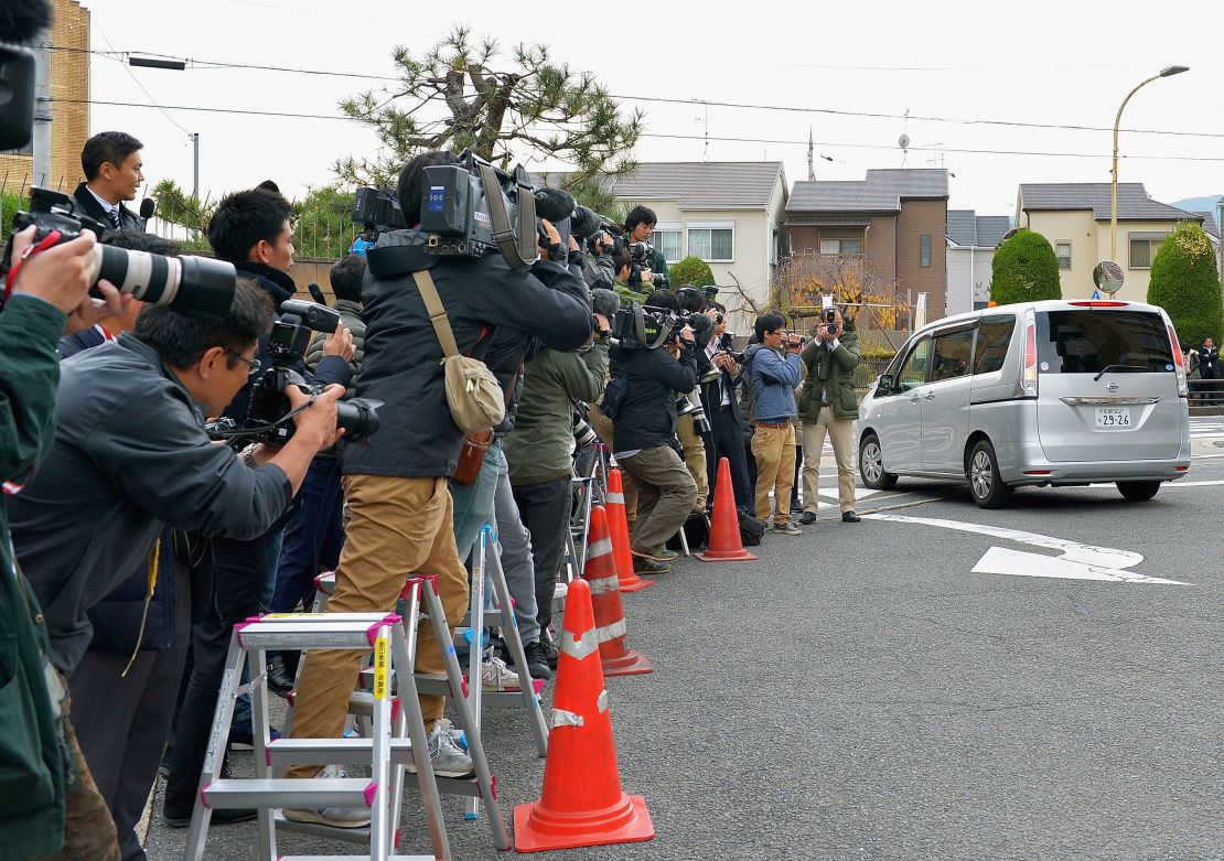 A car carrying Chisako Kakehi leaves the police station on November 20, 2014, in Muko, Japan. 