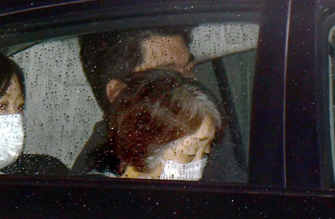 A police car carrying Chisako Kakehi leaves a detention facility in Osaka, Japan, on January 30, 2015.