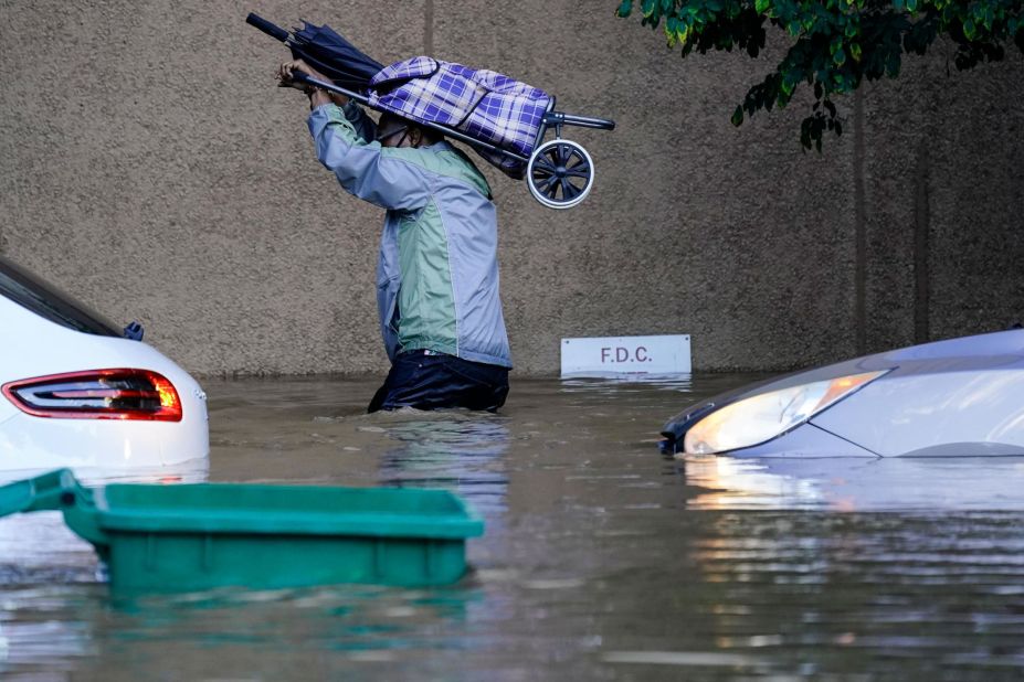 A person walks in floodwaters in Philadelphia on September 2.